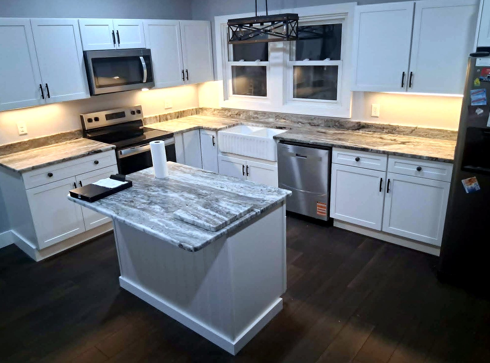White kitchen with marble island